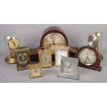 A box of clocks. Including glass dome torsion clock, mantel clocks, alarm clocks, etc.