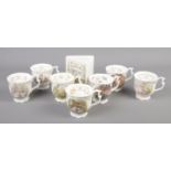 A collection of Royal Doulton Brambly Hedge. Includes Spring money box and seven cups.