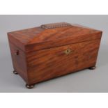 A Recency mahogany tea caddy of sarcophagus form. One handle damaged. Lock broken.