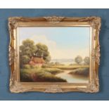 A Terence Grundy (Born 1956) gilt framed oil on canvas. Cottage by the river landscape. Dimension