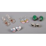Five pairs of silver earrings, to include Mexican and Amber examples.