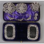 A cased set of Georgian steel shoe buckles, along with paste set broches clip on earrings etc.