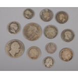 Twelve early 19th century silver coins. Including George III examples, etc. 71g.