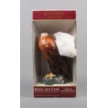 A Royal Doulton Golden Eagle White & Mackay scotch whisky bottle. Includes stopper and box.