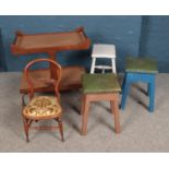 A collection of furniture including child's chair, trio of stools and drinks trolley.