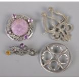 Four brooches. Includes three silver and one white metal Luckenbooth example.