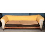 A large Victorian chesterfield sofa. (225cm x 69cm x 83cm) In need of reupholstering.