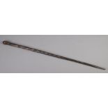 A carved African ebonised barley twist walking stick with mask head handle. (97cm)