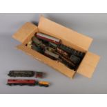 A box of Hornby Dublo trainset pieces including track and a selection of trains including The