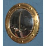A gilt framed convex mirror: 38cm diameter.
