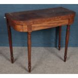 A Victorian mahogany fold over card table.