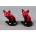 A pair of Royal Doulton Flambe foxes. Approx. 11cm tall.