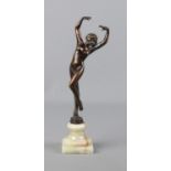 A small bronze figure on marble base depicting woman posing.