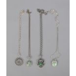 Four silver pendants with matching chains. Includes mounted 1914 Three Pence example.