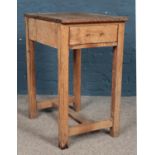 A small pine work table with lower drawer. Height: 79cm, Width: 46cm, Depth: 61cm. Requires new