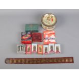 A box of miscellaneous including Mackintosh Quality Street Tin, Penny Leather Strap, Ogee Hair