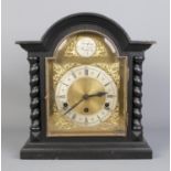 A Tempus Fugit wooden cased mantle clock, with barley twist supports. 37cm high. Key missing.