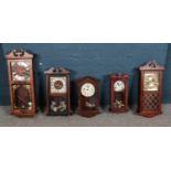 Five pendulum wall clocks ( four mechanical). Ranges in size: largest 71cm in height x 27cm Wide,