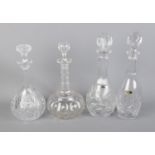 Four glass decanters.