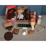 Three boxes of miscellaneous. Including Bakelite 'Byson' carpet clips, elephant figures, Bell's