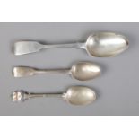 A trio of silver spoons including Basting Spoon (London 1843 62g), a engraved tea spoon (London 1846