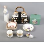 A box of assorted ceramics including Lilliput Lane, Royal Worcester and Coalport.
