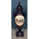 A large ceramic decorative lidded vase/urn. Depicting horses & carriage with figures. (90cm)
