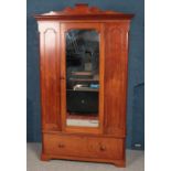 A Victorian mahogany mirror front wardrobe. (223cm x 136cm)