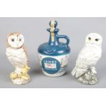 Three full & sealed alcohol decanters. Including two Whyte & Mackey whisky owls and Lamb's Navy