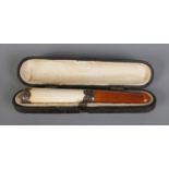 A silver and amber boxed cheroot cigarette holder. Hallmarked Birmingham 1920.