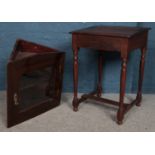 A vintage oak writing desk along with a wall mounted corner cupboard.