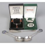 Two Celtic silver jewellery suites, together with two silver teaspoons and a Birmingham silver