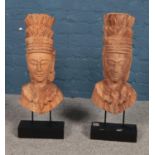 A pair of matching large wooden carved tribal figures on elevated bases. Approx. 66cm tall.
