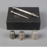 Three silver thimbles including Charles Horner example (Total weight 12g) with two silver graphite