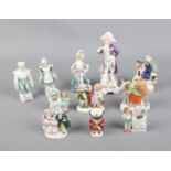 A quantity of small ceramic figurines including miniature jug and baskets.