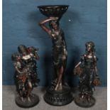 A composite figural stand along with a pair of matching figures. Largest 94cm.