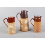 A trio of Royal Doulton stoneware jugs.