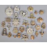 A metal box of cap badges. Including military examples, RAF, Royal Corps of Signals, Royal