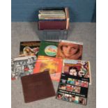 A box of LP records. Including Billy Joel, Shakin Stevens, Roy Orbison, Barry Manilow, etc.