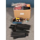 A large box of Scalextric to include track, controllers, selection of cars and instruction booklet.