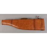A part leather shoulder of mutton gun case, with carry handle. 78cm long.