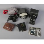 A quantity of cameras including Canon AE-1, Ilford Sportman, Sunpak auto134, Kodak Six-20 '