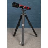 A Tasco 58T Telescope on tripod base, with booklet.