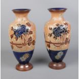 A pair of Royal Doulton stoneware vases.