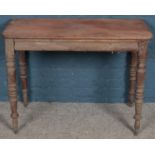 A Regency carved mahogany side table. Formally a fold over tea table (74cm x 101cm)