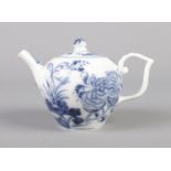 An 18th century Meissen miniature teapot decorated in underglaze blue. Height 8.5cm. Firing crack to