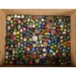 A box of mostly glass marbles. Including various sizes.