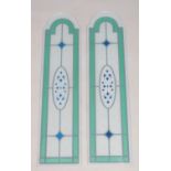 A modern pair of matching coloured glass window panels with dome tops. 103cm high.