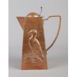 A Newlyn School copper hot water pot designed by Herbert Dyer (1898â€“1974). Decorated with a sea