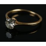 An 18ct gold diamond solitaire ring. Size L, 1.62g.